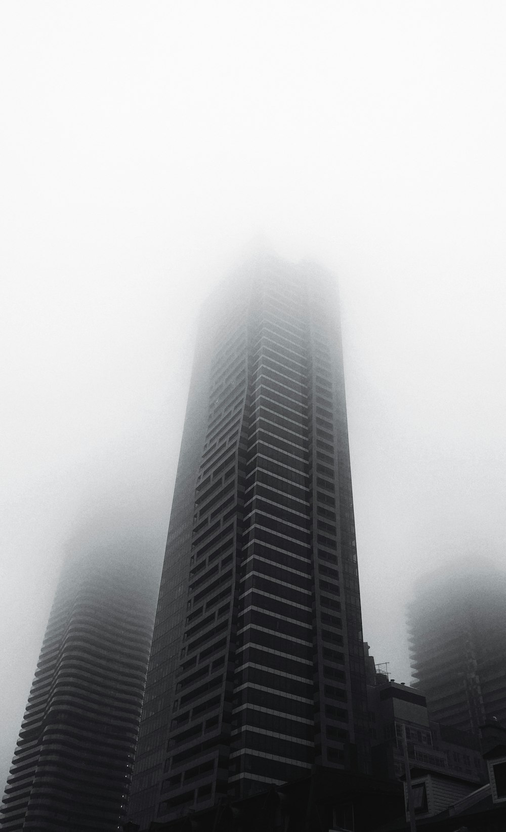 grayscale photo of high rise building