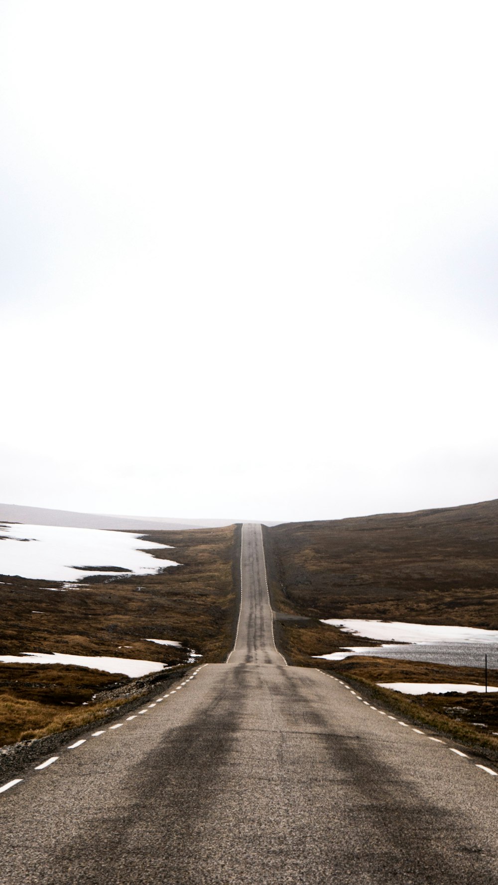 gray road under white sky