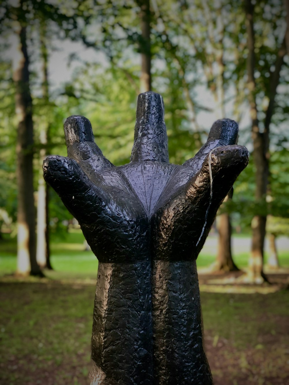 black hand statue