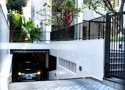 Close-up of cars smoothly exiting a controlled parking area.