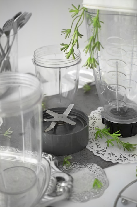 Photo of portable blenders and air fryers arranged on a kitchen counter