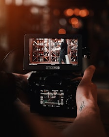 black DSLR camera on selective focus photography