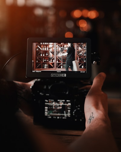 black DSLR camera on selective focus photography