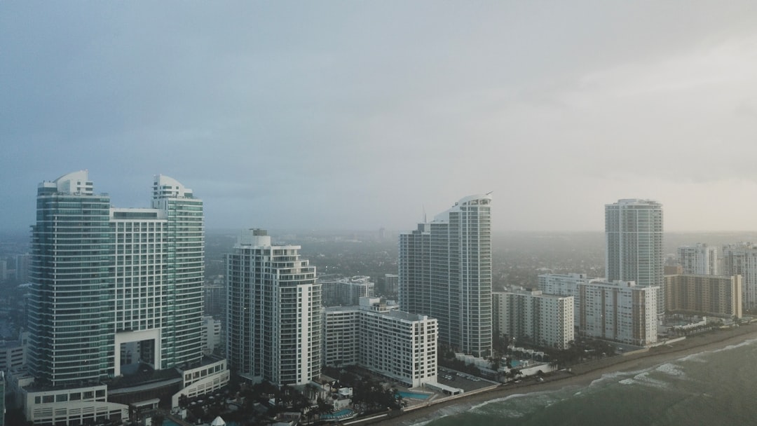 bird's eye view photography of high-rise buildings under gray sky