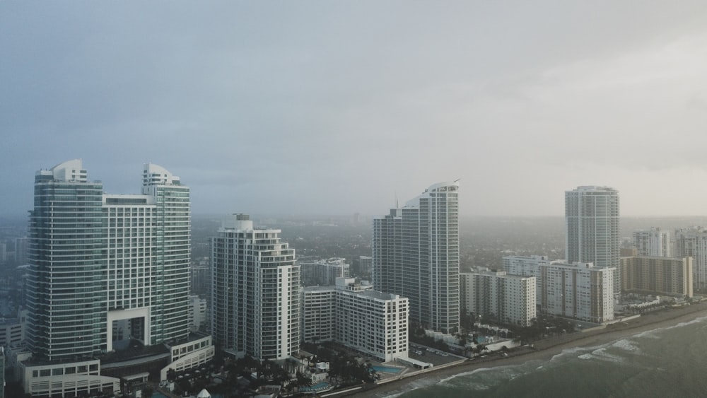bird's eye view photography of high-rise buildings under gray sky