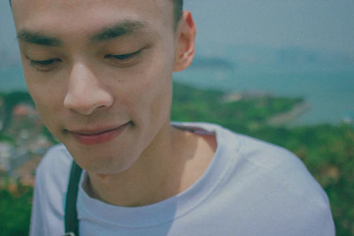 A serene portrait of a coach in a peaceful natural setting, radiating calm and confidence.