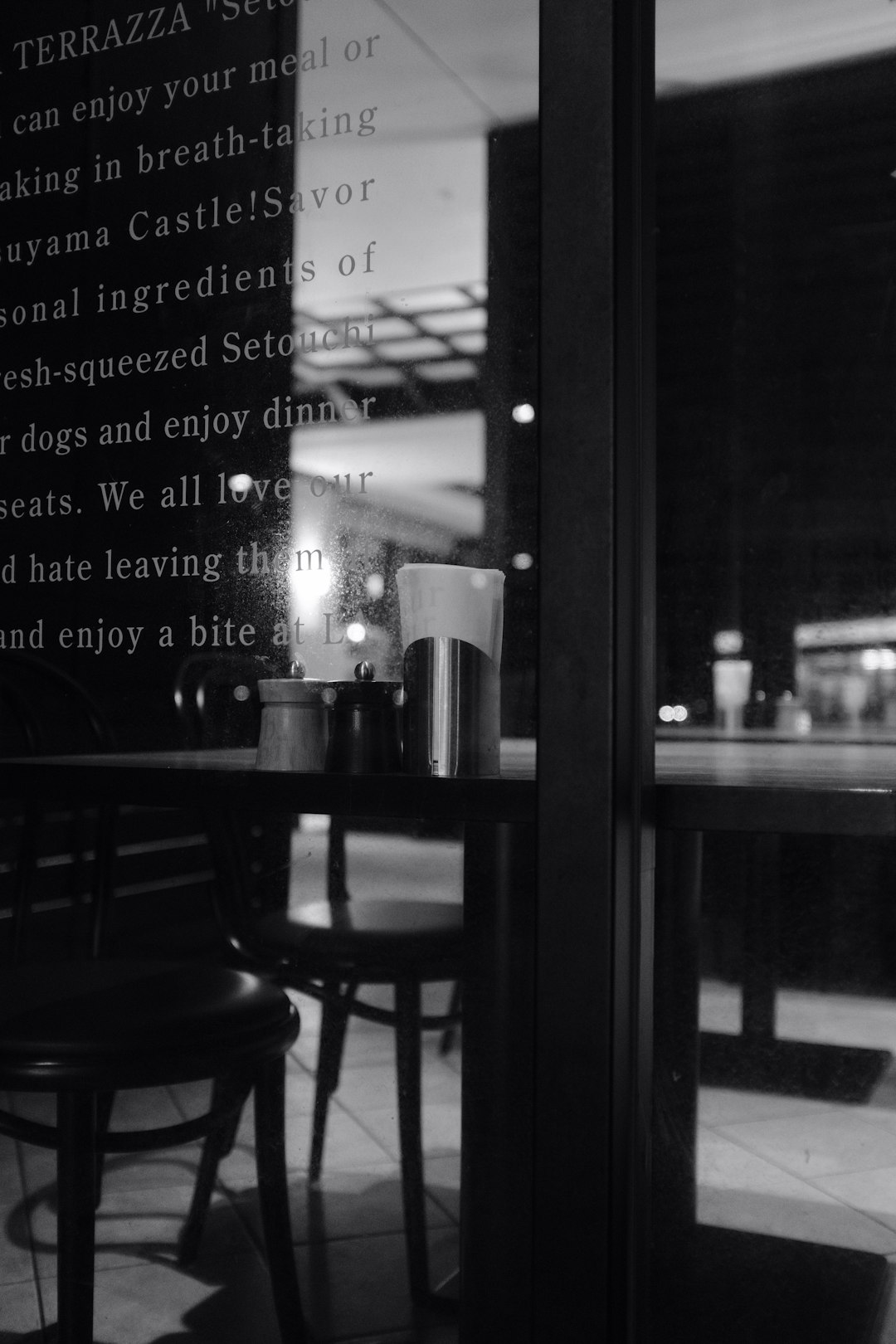 grayscale photography of dining table