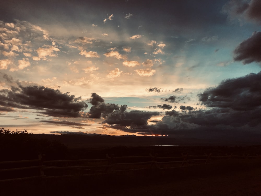 low angle photo of dramatic clouds during sunset