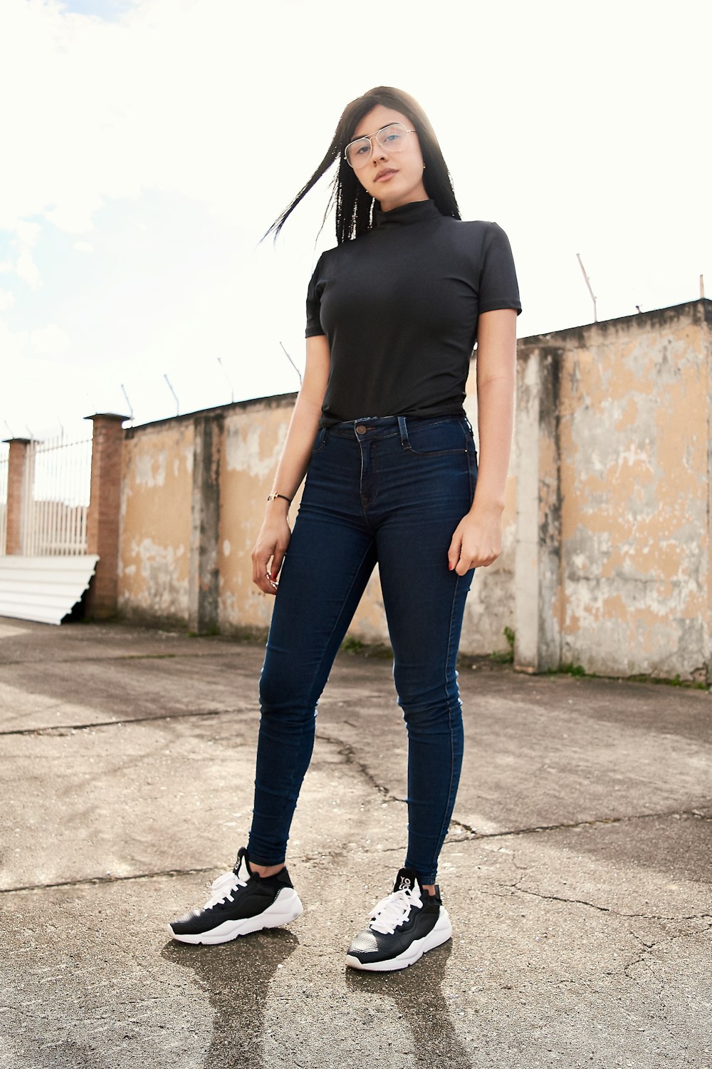 woman wearing black shirt and black pants