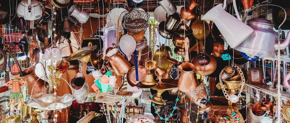 a display of many different types of pots and pans