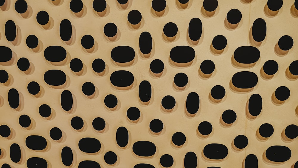 a close up of a wall with holes in it