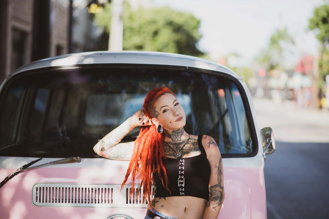 woman standing in front of Volkswagen T1 van