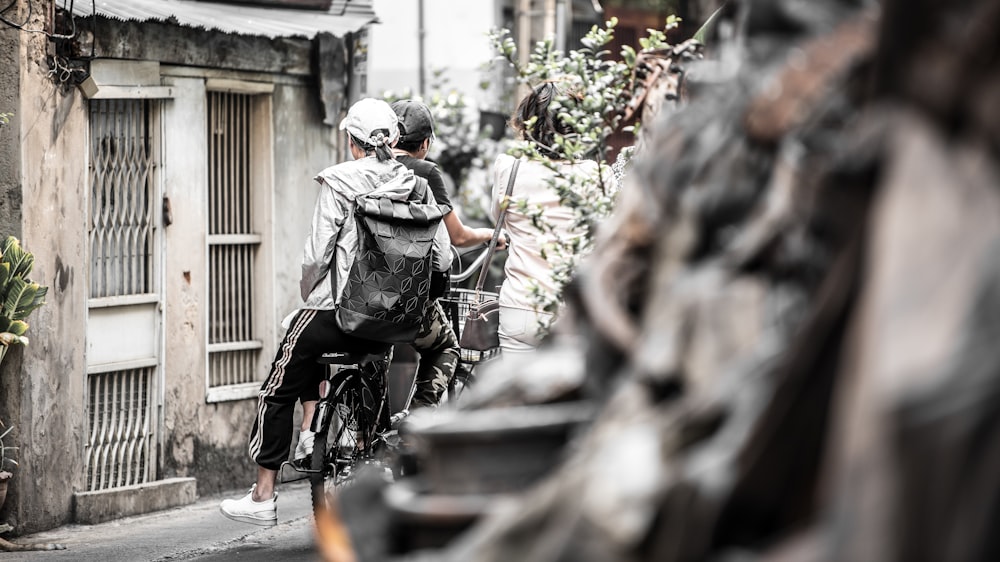 two people riding a bicycle