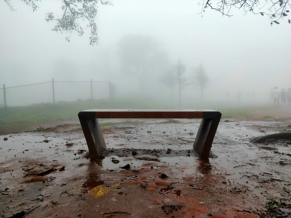 brown concrete bench with fog