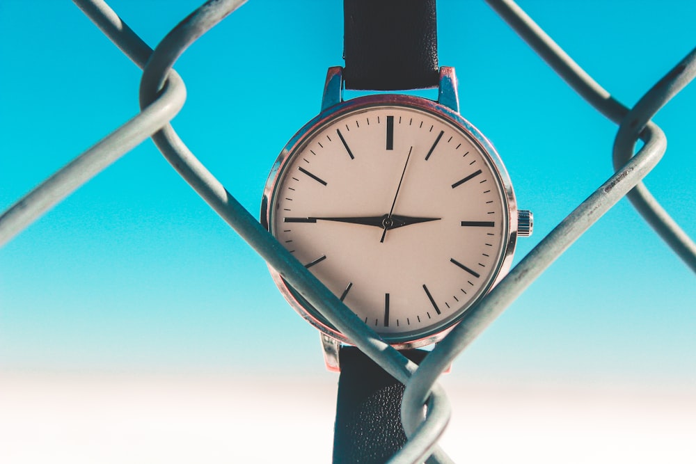 round silver-colored analog watch