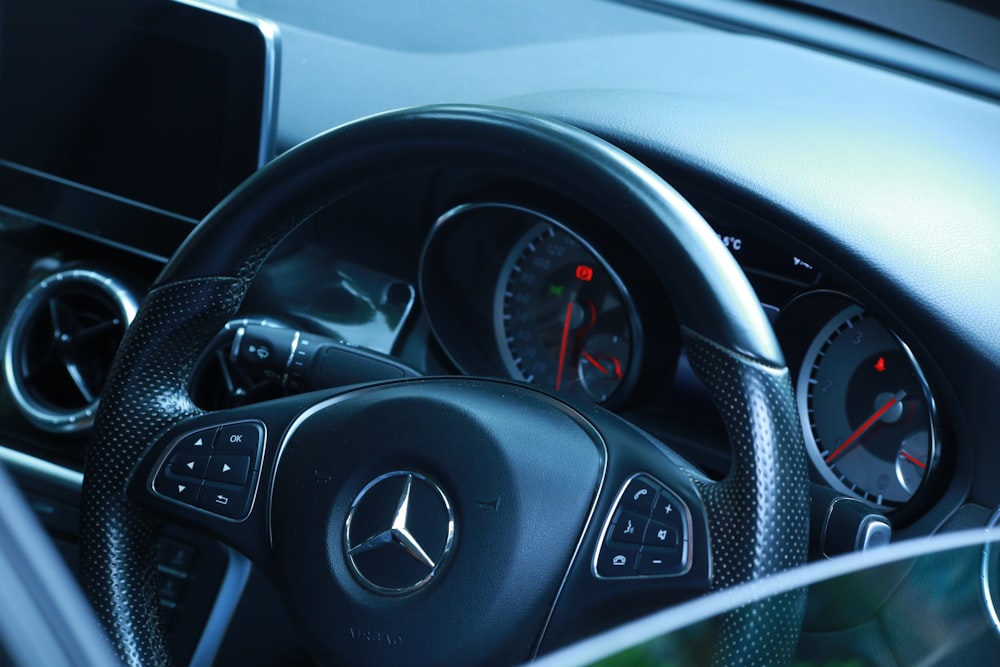 close-up photography of Mercedes-Benz steering wheel
