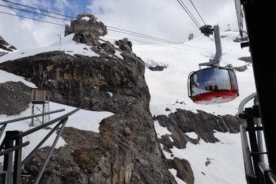 a ski lift going up the side of a mountain