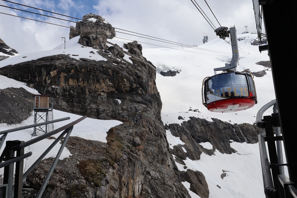 a ski lift going up the side of a mountain