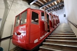red staircase train with open doors