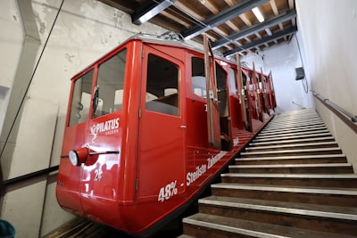 red staircase train with open doors