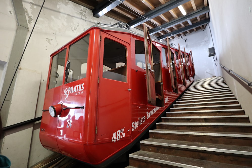 red staircase train with open doors