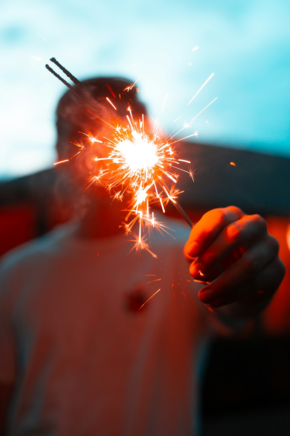 person holding sparkler