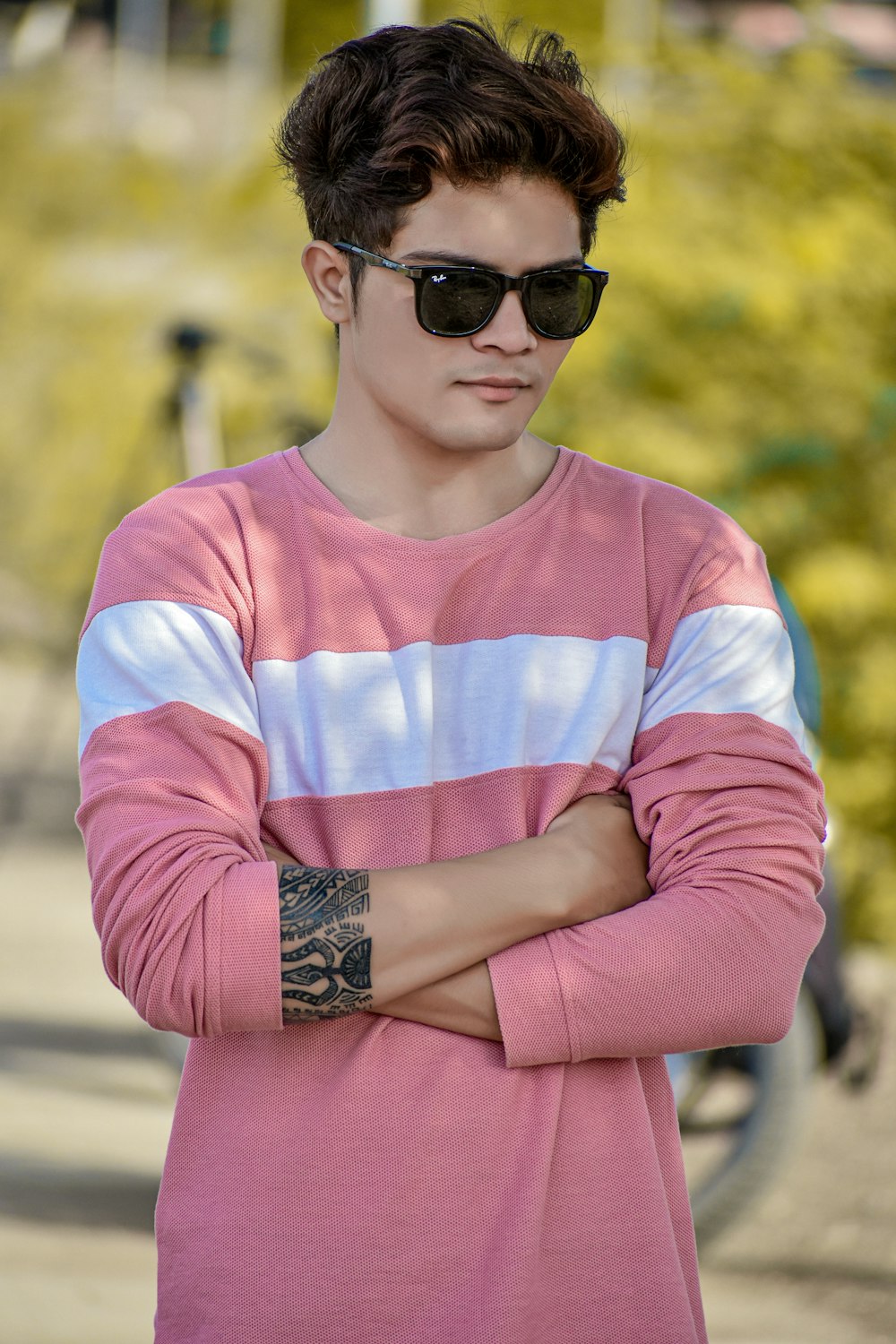person wearing pink and white shirt