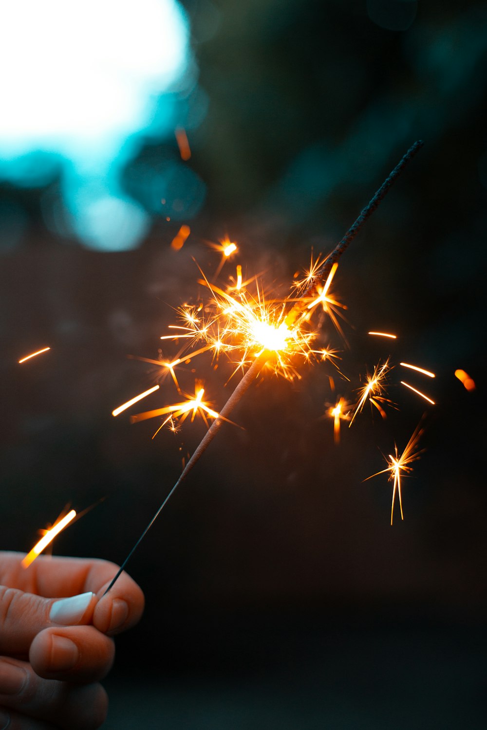 person holding sparkler