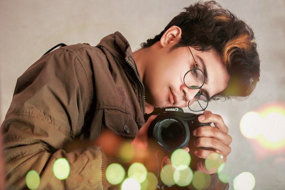 person holding Canon camera