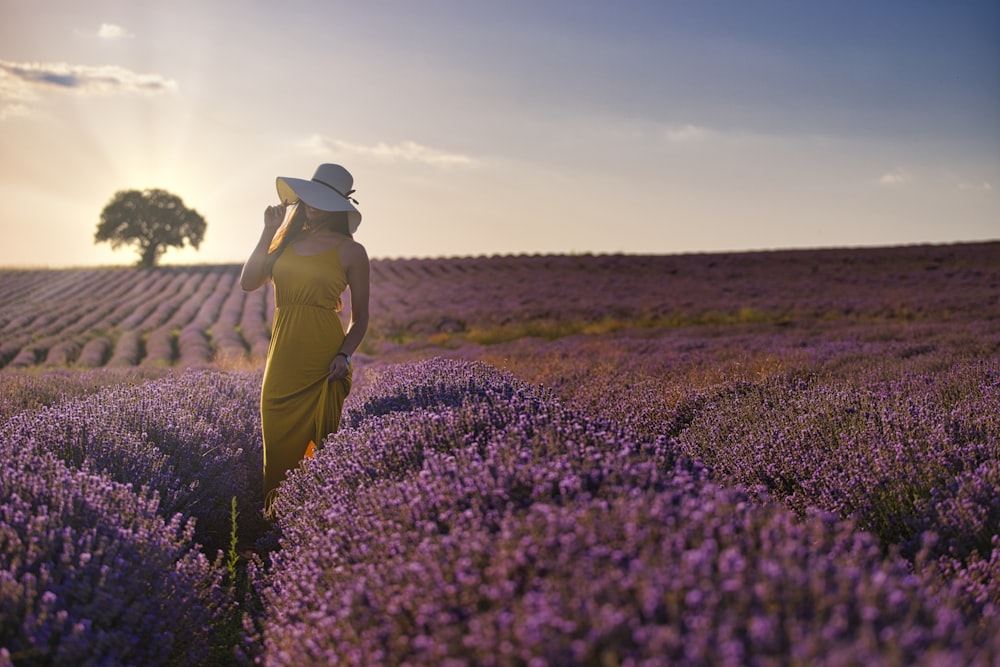 woman standing on pink flower field