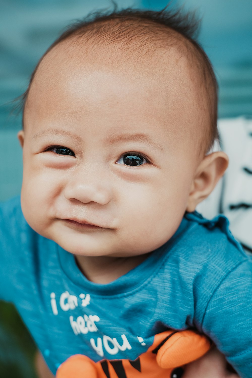 baby wearing blue top