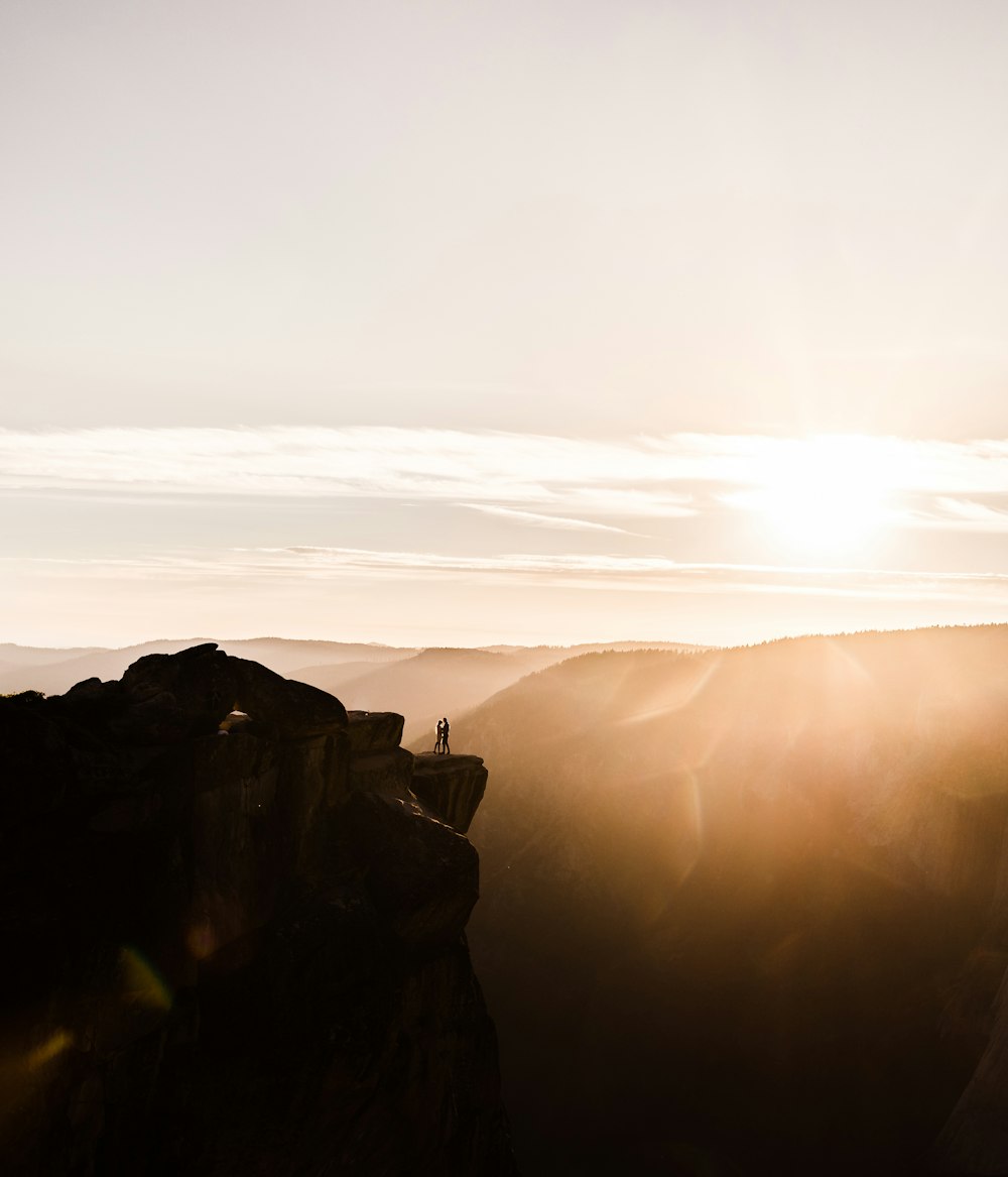 person standing on rock formation