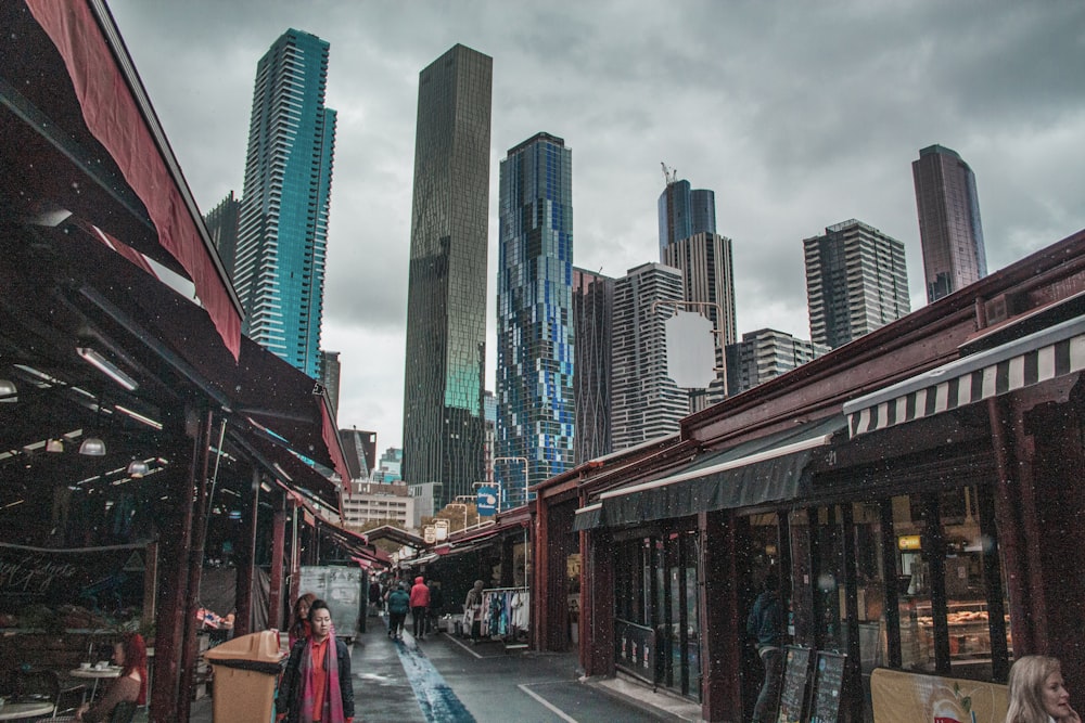 city with high-rise buildings viewing walking near stores