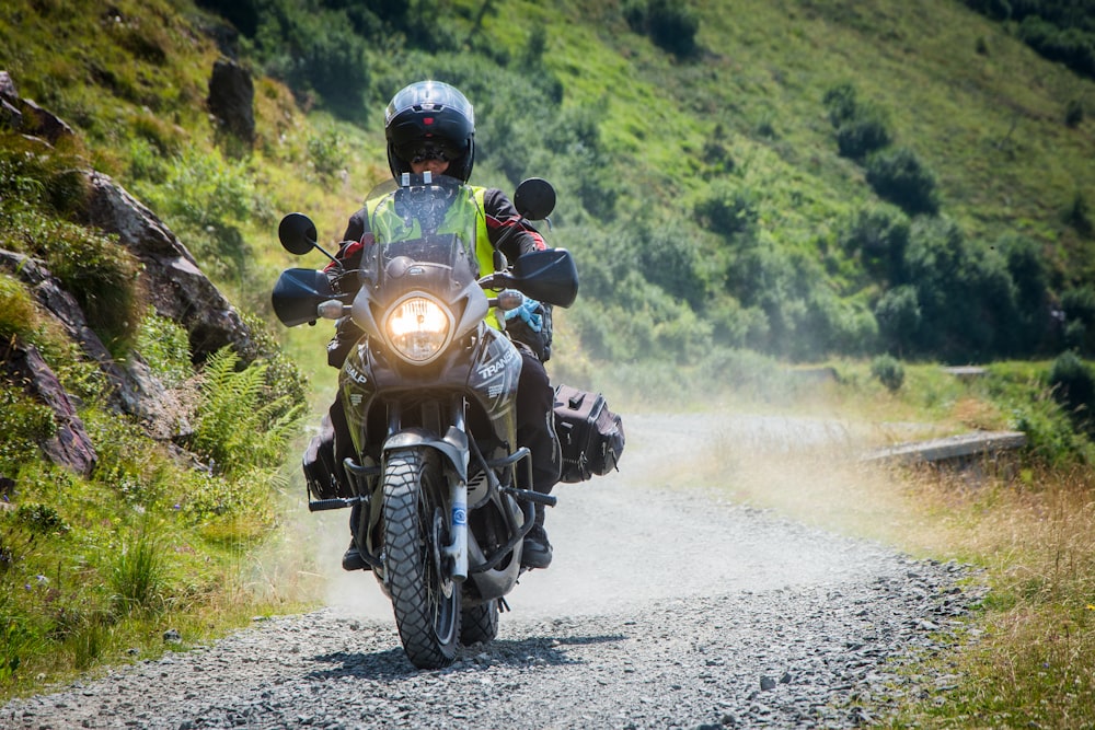 person riding black motorcycle