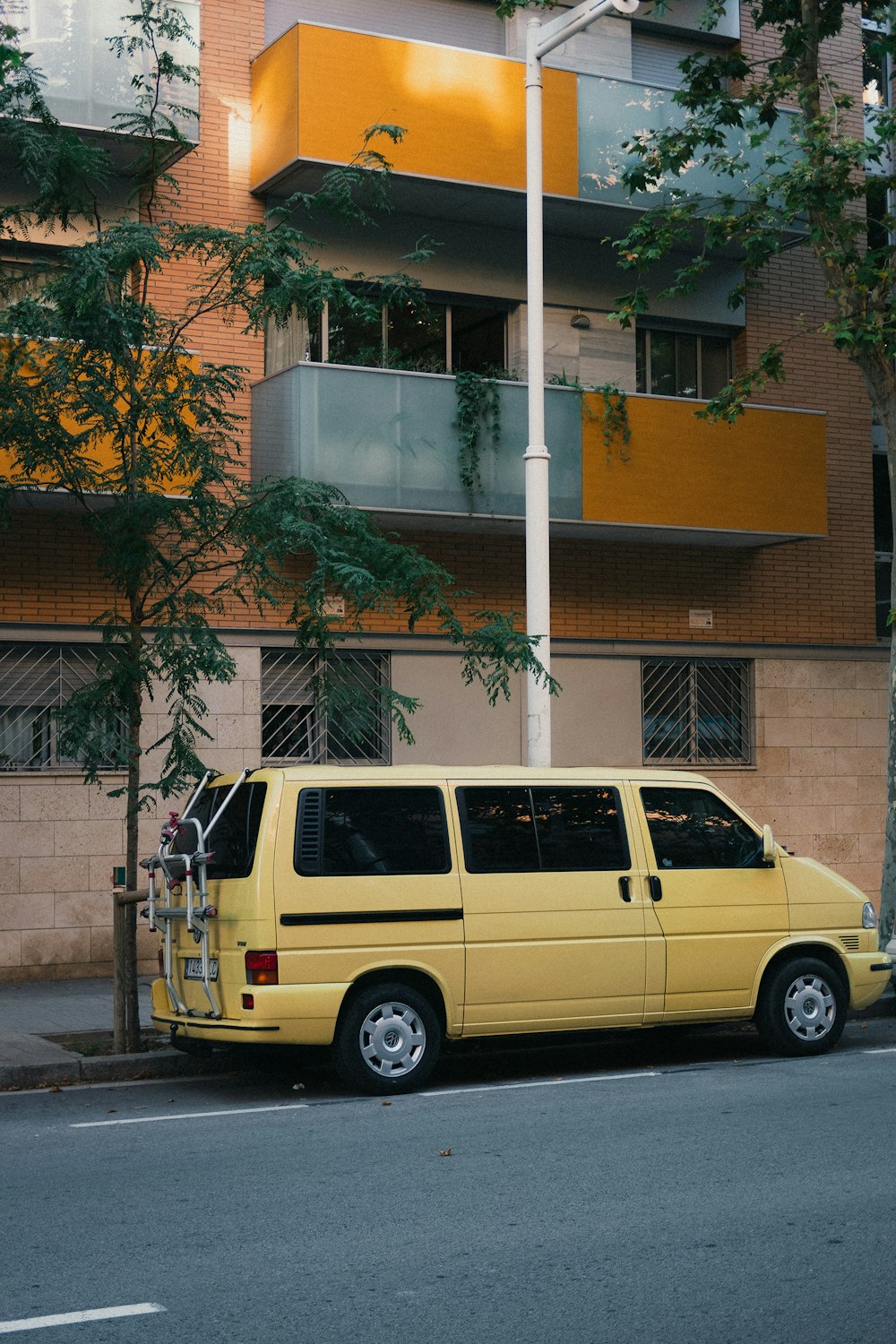 yellow vehicle near building