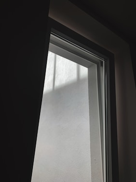 Bright, modern window installation showcasing a sunlit room with clear glass panes.