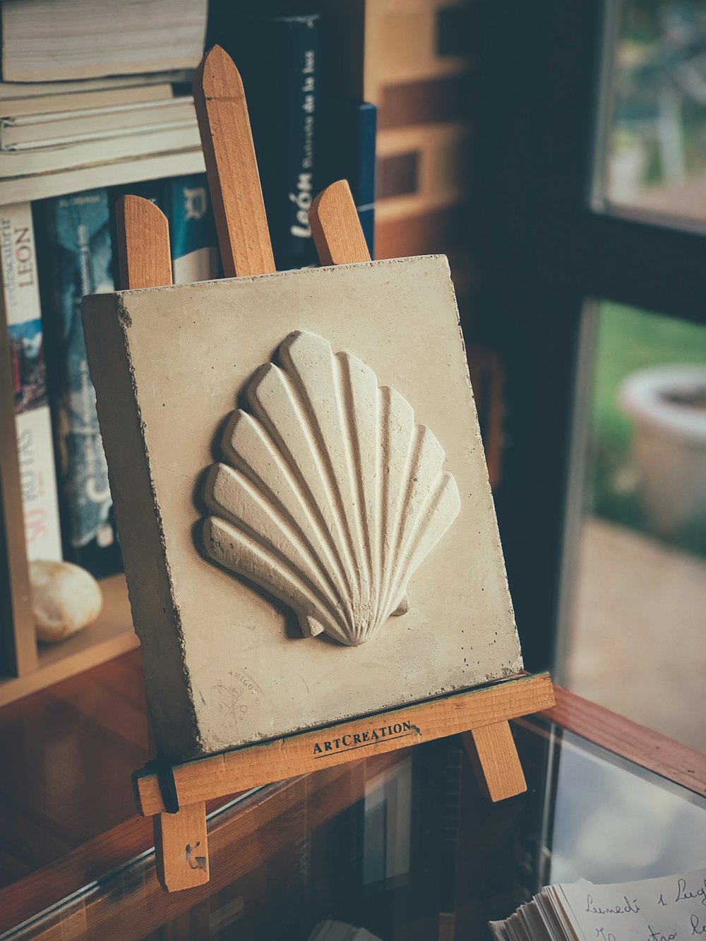 a painting of a shell on a easel