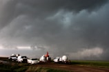 A fleet of VORTEX2 vehicles tracks a supercell thunderstorm near Dumas. The blue-green color in the cloud is associated with large hail.