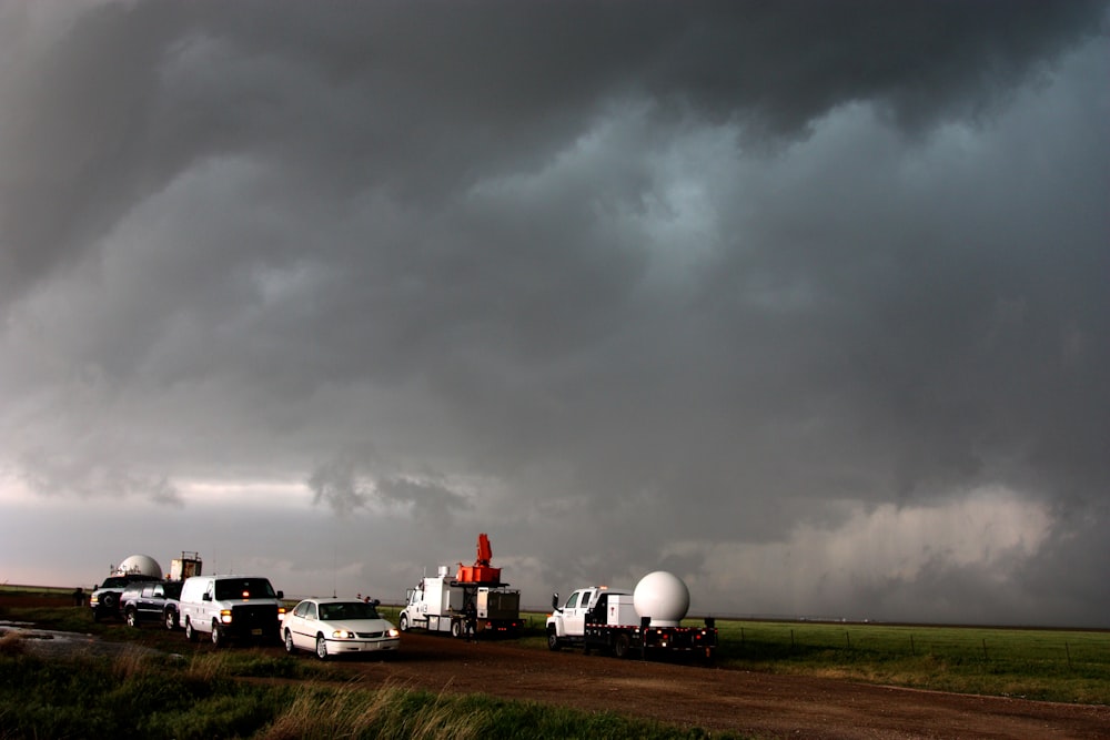 A fleet of VORTEX2 vehicles tracks a supercell thunderstorm near Dumas. The blue-green color in the cloud is associated with large hail.