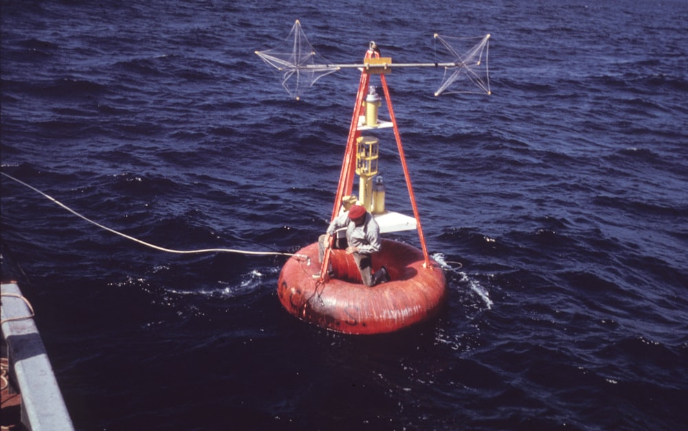 red floating device close-up photography