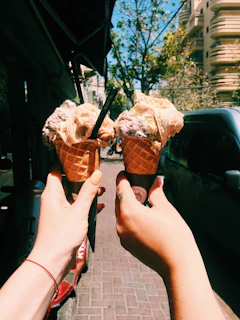 A joyful family sharing gelato cones on a warm afternoon at the seaside.