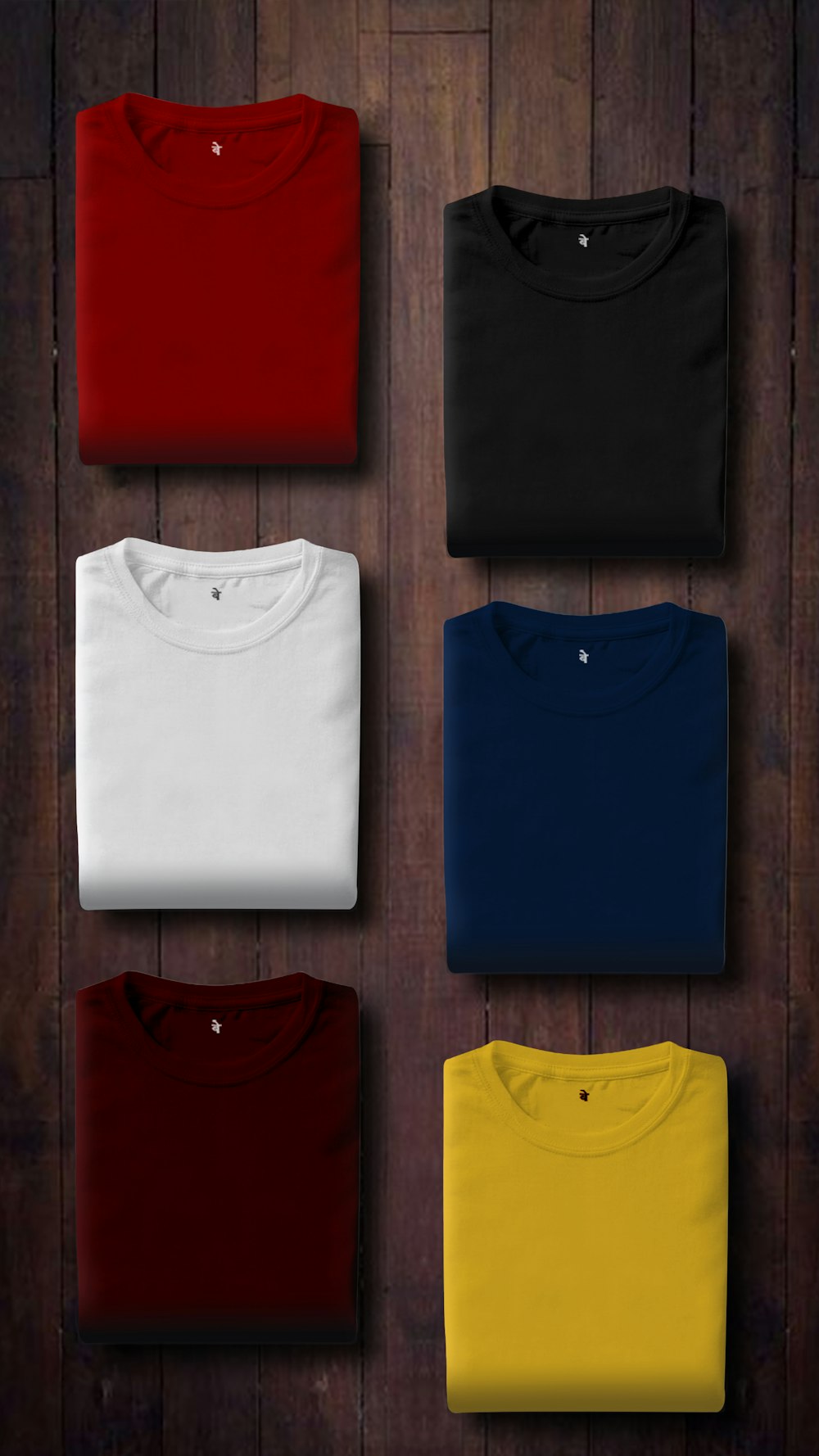 assorted color folded shirts on wooden panel