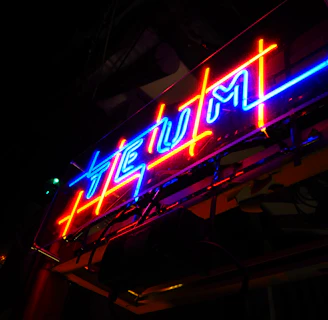 Glowing neon sign with bonus offers flashing against a dark background