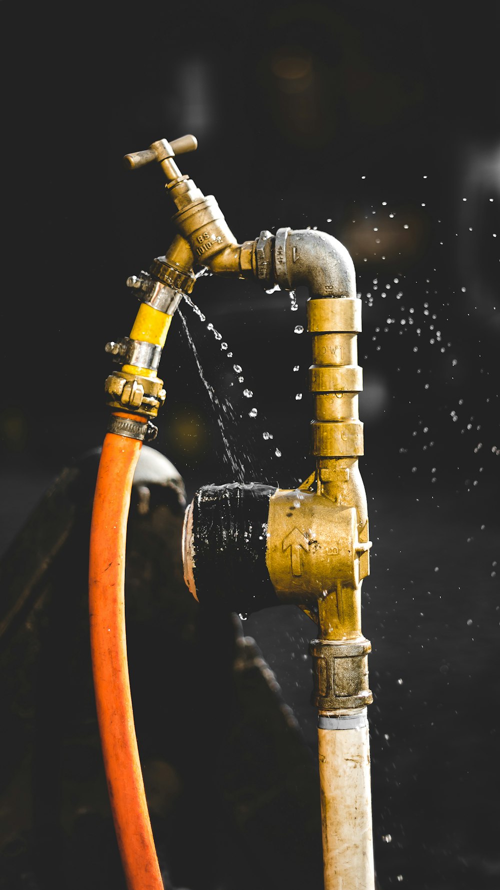 gold-colored faucet close-up photography