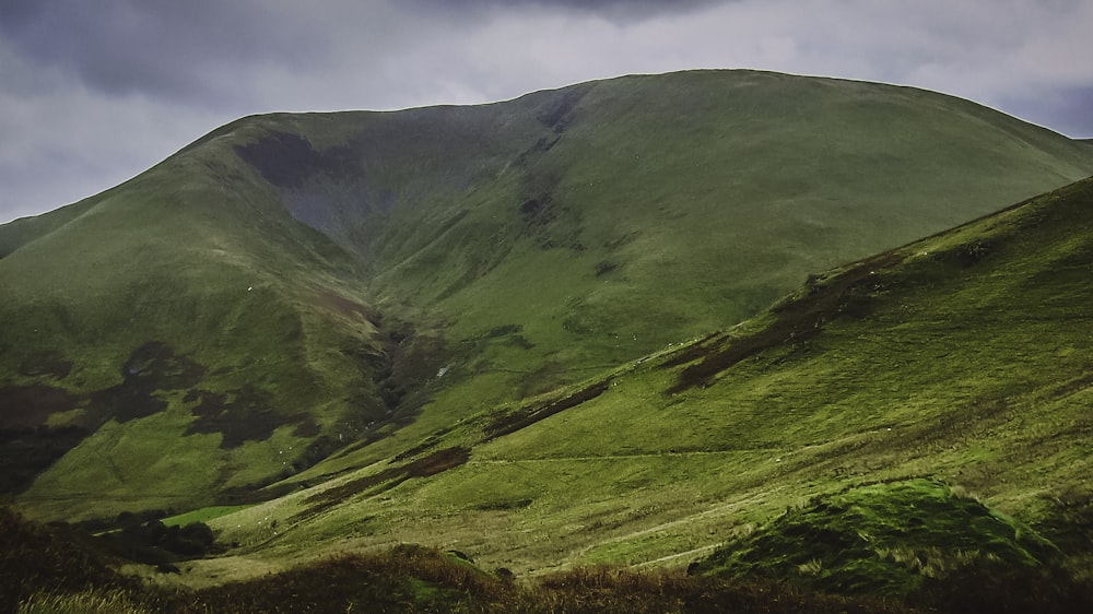 landscape photography of green mountain