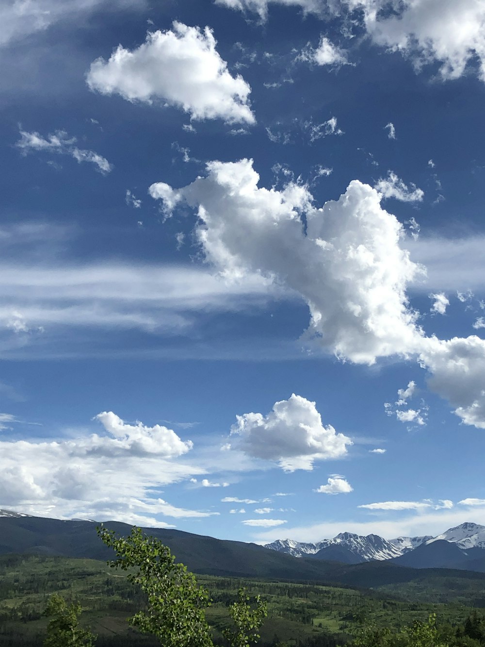 mountains under cloudy sky during daytime