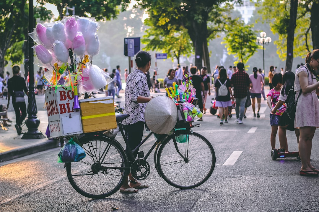 person riding bicycle with cotton candies