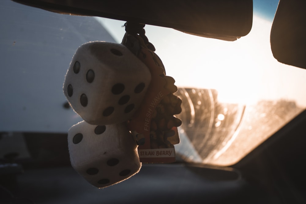 two dice in vehicle