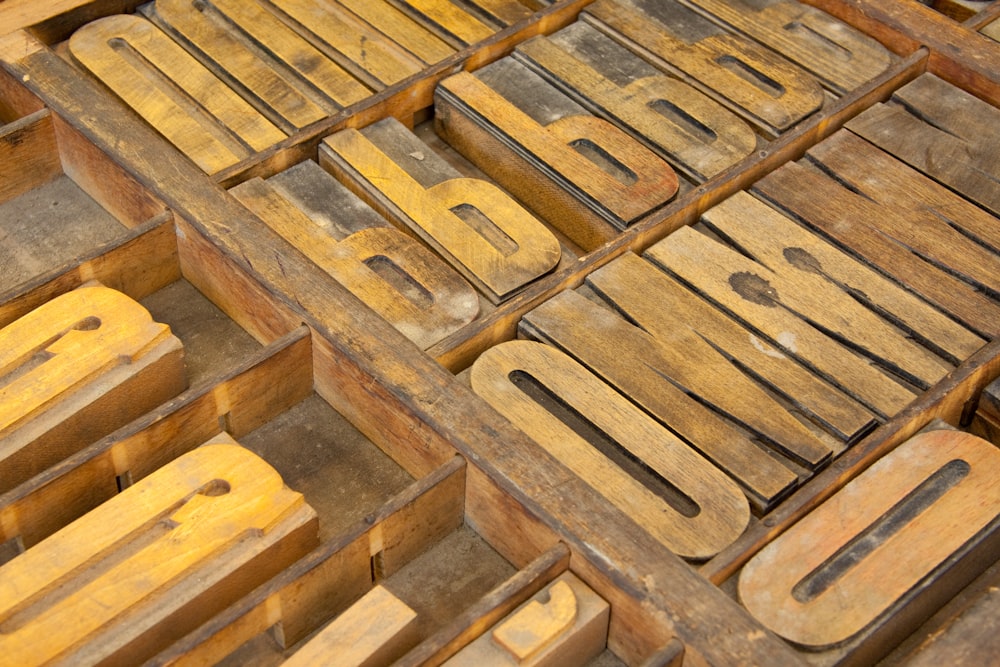 a pile of old wooden letterpresss sitting on top of each other