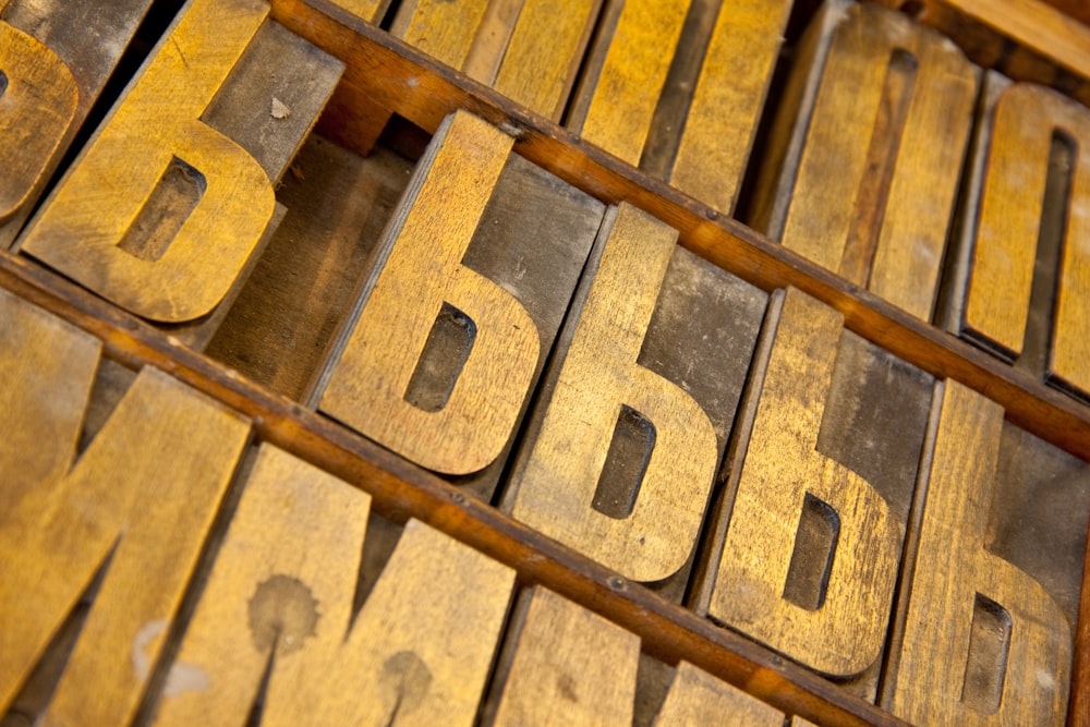 a close up of a wooden type of alphabet
